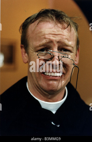 Les Dennis Comedian and TV presenter in one of his comedy roles as a vicar Stock Photo