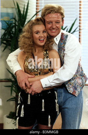 Les Dennis Comedian and TV presenter wraps his arms around Comediene LIsa Maxwell Stock Photo