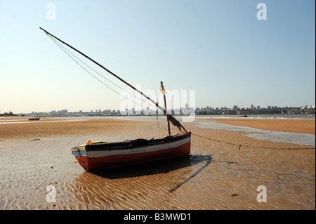 A boat on the beach in Catembe, a suburb across the bay from Maputo, Mozambique Stock Photo