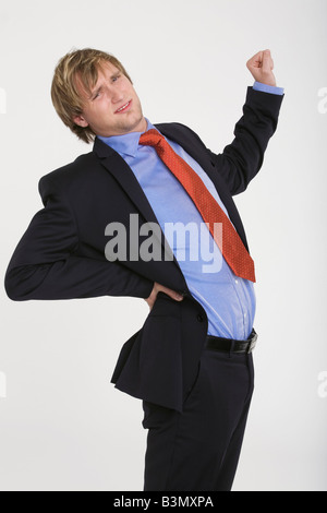 Young businessman suffering from backache Stock Photo