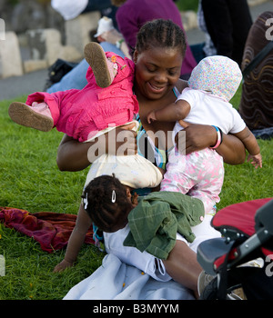 woman with two toddlers Stock Photo