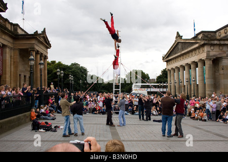 Acrobats street act at the Fringe Festival outside the National Gallery of Scotland, Edinburgh Scotland Stock Photo