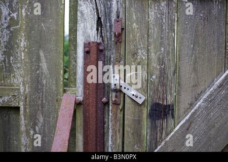 Rusting metal stakes and locks in back garden gate in the tiny hamlet of Waterloo, Isle of Skye, Scotland. Stock Photo