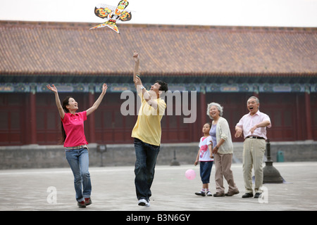 chinese families flying kites in the forbidden city,beijing,china Stock Photo