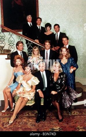 DYNASTY  Cast of the US 1980s TV series with in front row from left Joan Collins, John Forsythe and Linda Evans Stock Photo