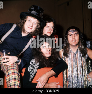SLADE  UK glam rock group in 1973 with from left Noddy Holder, Jimmy Lea, Dave Hill and Don Powell seated Stock Photo