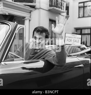 Tony Curtis, american actor poses for pictures in his Alvis TE21 motorcar in Knightsbridge, London, Thursday 2nd September 1965. Stock Photo