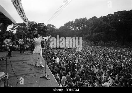 Mick Jagger sings on stage at free Rolling Stones concert in Hyde Park London July 1969 More than 300 000 rock fans attend the concert given by the Rolling Stones in memory of guitarist Brian Jones who died two days earlier Stock Photo