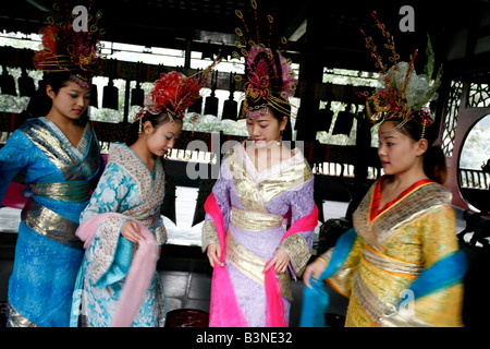 Young Chinese girls dressed in traditional costumes with head dresses at Wu Hou Memorial Temple Stock Photo