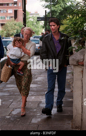 Paula Yates TV Presenter September 1998 Leaving her home in Notting Hill holding her daughter Heavenly Hiraani Tiger Lily her new boyfriend Kingsley O Keke walking beside her mirrorpix Stock Photo