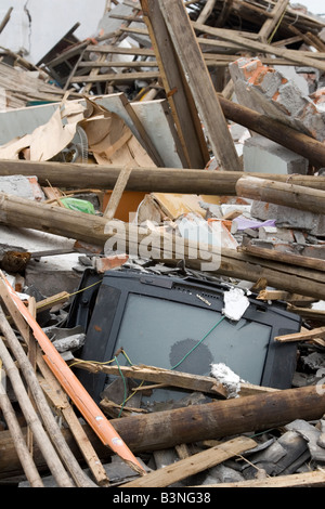 A TV buried among the ruins of a house destroyed by the massive earthquake of May 12 2008 in Sichuan Stock Photo