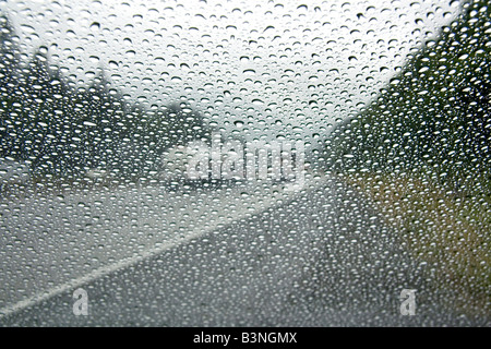 Raindrops on the windshield of car in Washington Stock Photo