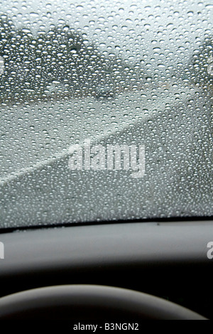 Raindrops on the windshield of a car in Washington Stock Photo