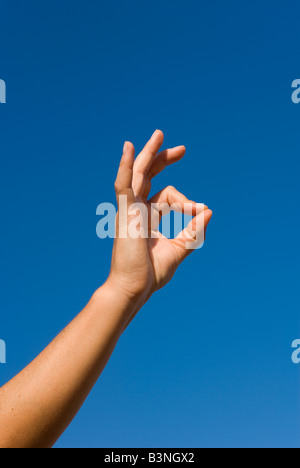 Model Released Detail of female forming Mudra hand gesture used in yoga practice meditation and for healing purposes Stock Photo