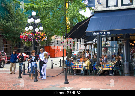 People dine at a sidewalk cafe in the Gastown area of Vancouver British Columbia Canada Stock Photo