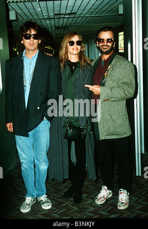 George Harrison with fellow ex Beatle Ringo Starr and his wife Barbara Bach 1990s Stock Photo