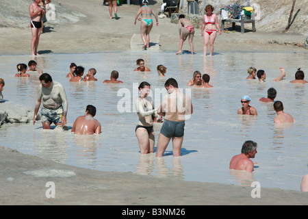 Italy, Sicily, Province of Messina, Aeolian Islands, Lipari Islands, Tyrrhenian Sea, Mediterranian Sea, Vulcano Island, volcanic island, Porto di Levante, tourists taking a sulfur mud bath in a hot spring, therapy against skin diseases, rheumatism and art Stock Photo