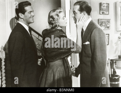 DIAL M FOR MURDER  1954 Warner film with from left: Robert Cummings, Grace Kelly and Ray Milland produced by Alfred Hitchcock Stock Photo