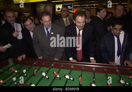 Tony Blair and Michael Heseltine December 2000 at the Millennium Dome to meet workers on the site Also there was Pierre Yves Gerbeau who ran the Dome Here playing table football with John Prescott watching Stock Photo