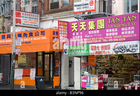 San Francisco California Bilingual signs on stores in Chinatown Stock Photo