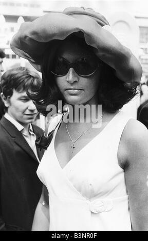 Lady in puffed hat and sunglasses at Royal Ascot in June 1968 Sixties fashion Stock Photo