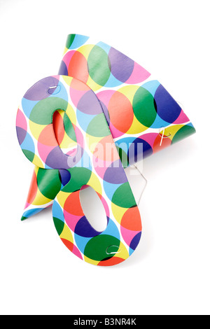 Two multi-colored carnival masks and beads on yellow background. Mardi ...