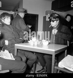 George Harrison, John Lennon smoking - The Beatles in a tv studio in ...