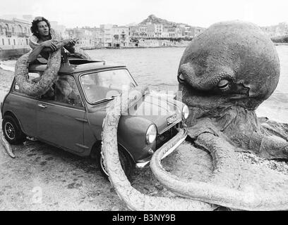 Roy Bella battles with an Octopus on beach in Malta stars in film Seven Cities to Atlantis November 1977 Stock Photo