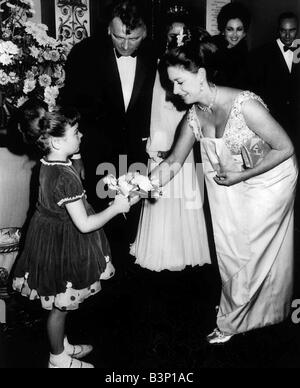 Princess Margaret meets Richard Burton and Elizabeth Taylor At premiere of Staircase Fiona McLean presented her Royal Highness with a bouquet of flowers Stock Photo