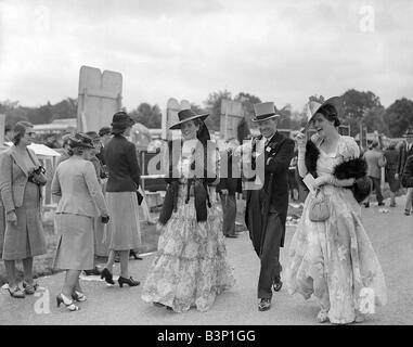 Fashion at Royal Ascot June 1935 Ladies Day women show off their style of dress and hats Stock Photo