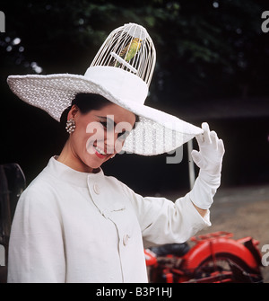 1968 Clothing Ascot Fashion Hats and Dresses Jane Bough in a creation by Don Anderson bird cage hat Stock Photo