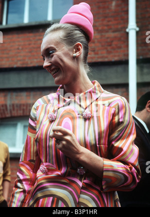 1968 Clothing Ascot Fashion Hats and Dresses Mrs Giana Timothy wearing a small hive like hat and a striped dress Stock Photo