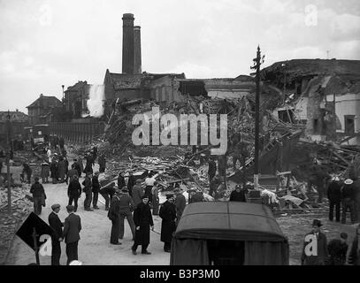 WW2 Air Raids Ilford Essex East London WW2 Bomb damage in Ilford East London after an air raid is looked over by emergency service as they look for survivors amongst the rubble of collapsed buildings homes and factorys Stock Photo