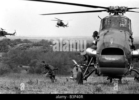 Heavy Equipment Drop Rehearsal April 1967 Westland Wessex support helicopters demonstrate the rapid movement of men and equipment for a helicopter borne attack by two companies of the 3 battalion the Parachute regiment Seen here near Aldershot during rehearsal for a demonstration of the use of airborne troops for the Queen and Prince Philip British Troops Army The Paras The Red Devils a soldier runs from the helicopter Stock Photo