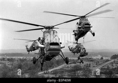 Heavy Equipment Drop Rehearsal April 1967 Westland Wessex support helicopters demonstrate the rapid movement of men and equipment for a helicopter borne attack by two companies of the 3 battalion the Parachute regiment Seen here near Aldershot during rehearsal for a demonstration of the use of airborne troops for the Queen and Prince Philip British Troops Army The Paras The Red Devils Stock Photo