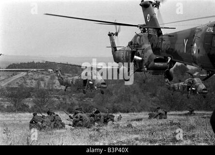 Heavy Equipment Drop Rehearsal April 1967 Westland Wessex support helicopters demonstrate the rapid movement of men and equipment for a helicopter borne attack by two companies of the 3 battalion the Parachute regiment Seen here near Aldershot during rehearsal for a demonstration of the use of airborne troops for the Queen and Prince Philip British Troops Army The Paras The Red Devils Soldiers crouch down watching the helicopters land Stock Photo