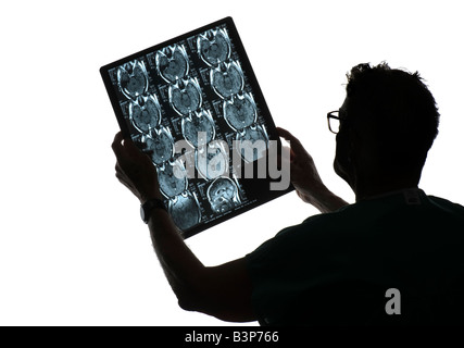 silhouette of doctor examining MRI x-ray Stock Photo