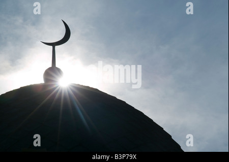 Silhouette of a dome and crescent moon on the roof of the mosque in Kaunas second city in Lithuania Stock Photo