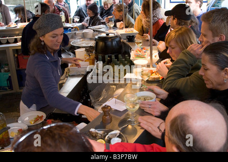 Street front restaurant 'Mer du Nord' serving freshly cooked seafood directly to standing customers, Brussels Belgium Stock Photo