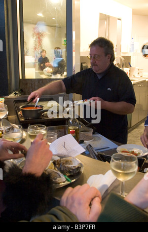 Street front restaurant 'Mer du Nord' serving freshly cooked seafood directly to standing customers, Brussels Belgium Stock Photo