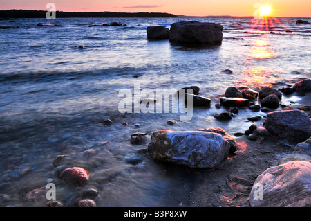 Sunset at the rocky shore of Georgian Bay Canada Awenda provincial park Stock Photo