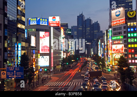 Japan, Tokyo, The busy neon lit streets outside the Shinjuku Station including the Park Hyatt Hotel which was the set for the film Lost in Translation
