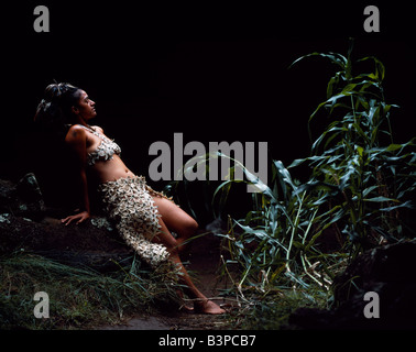 Chile, Easter Island, Te Pahu. A Rapanui girl, Uri Francesca Avaka, in traditional costume made from reeds Stock Photo