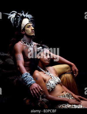 Chile, Easter Island, Te Pahu. Rapanui man and woman, Singa Miguel Angel and Uri Francesca Avaka, in traditional costume at Te P Stock Photo