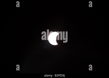 Moon partially covering sun approaching total solar eclipse 2008 Stock Photo