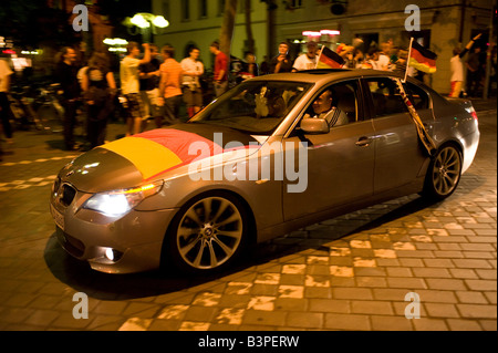 German fan participating in a convoy of cars during the victory celebrations after Germany won 2:0 against Poland in a soccer g Stock Photo