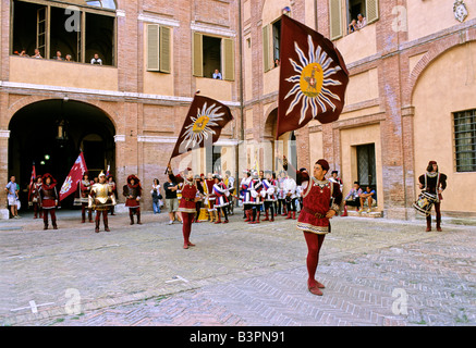 Historic Palio horse race, participants waving banners representing the Contrada di Torre, Tower District, Piazza di Prefettura Stock Photo