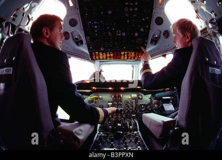 Finnair pilots in the cockpit of a commercial jet aircraft preparing for take-off. Stock Photo