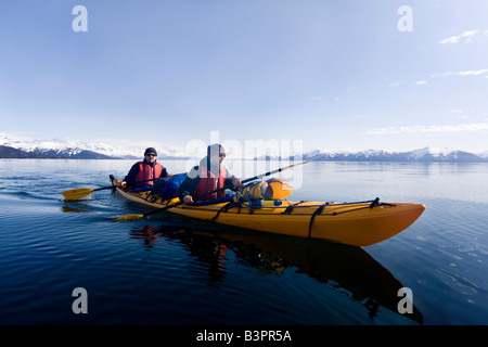 Sea kayakers, evening light, Pacific Coast, Prince William Sound, Chugach National Forest, Alaska, USA Stock Photo