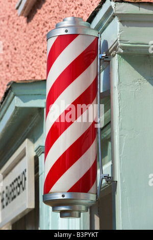 Red and White striped barbers sign, Long Melford, Suffolk, England Stock Photo